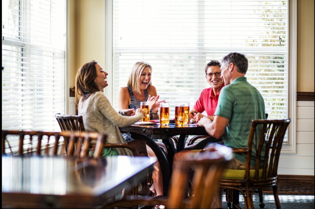 Family Laughing at Dinner Table